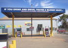 ... nach Hermannsburg. Der richtige Spruch für eine Tankstelle. Alcohol available inside.